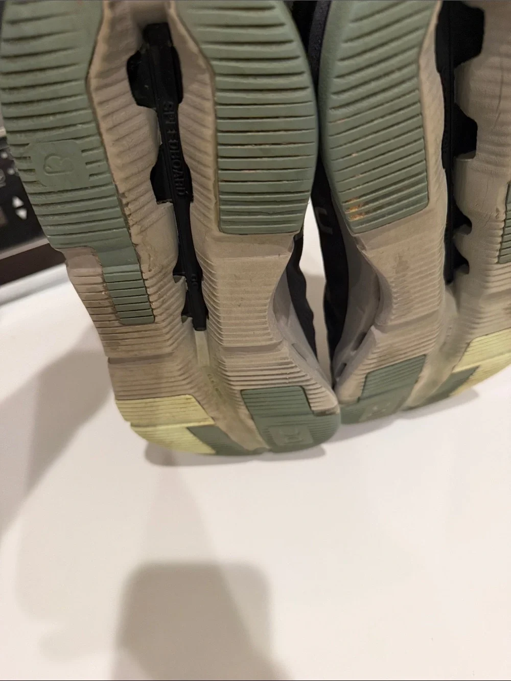 On Running woman’s Black Athletic Shoes with Lime and Pink Accents